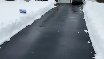Cleared driveway after professional snow removal by Chop Chop Landscaping in Staten Island, NY