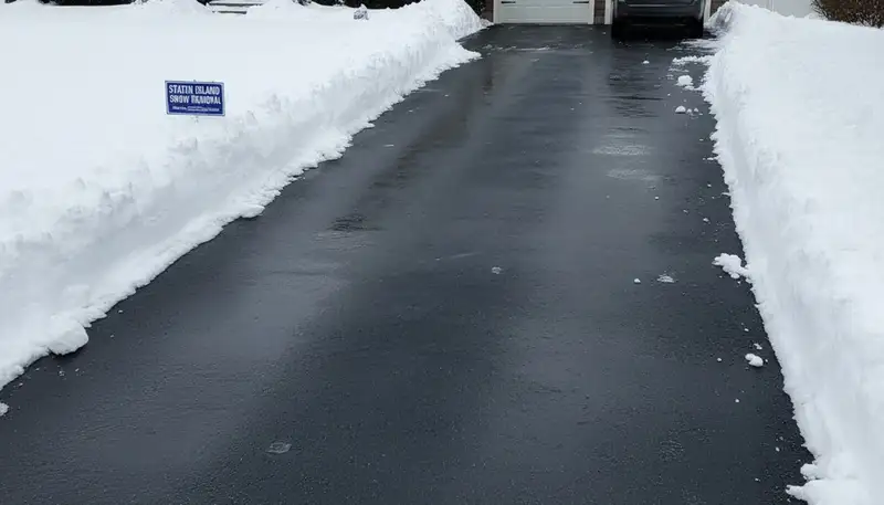 Cleared driveway after professional snow removal by Chop Chop Landscaping in Staten Island, NY